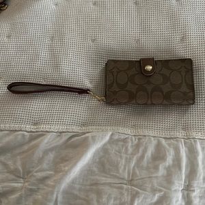 Coach brown and tan phone wristlet. Slightly used